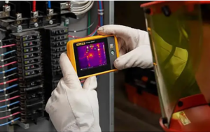 Thermal camera inspecting an electrical panel for abnormal heat