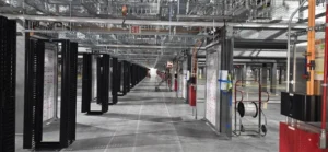 Electrical infrastructure and equipment rows inside a data center facility